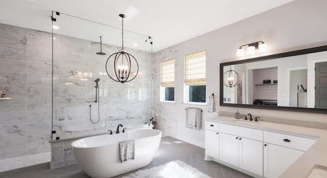 LOT13 Ridgeway Trl, Johnson City, TX 78636 - bathroom featuring a walk in shower, a freestanding tub, tile walls, a chandelier, and vanity