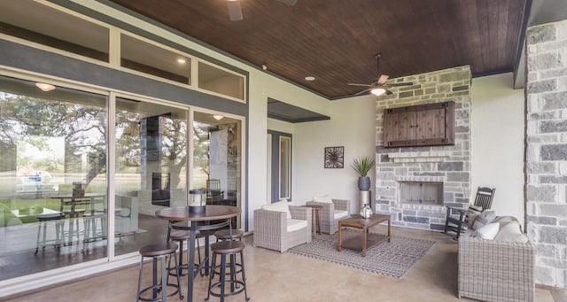 LOT13 Ridgeway Trl, Johnson City, TX 78636 - view of patio / terrace with a ceiling fan and an outdoor living space with a fireplace