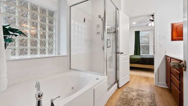 30 Stone Terrace Dr, Austin, TX 78734 - ensuite bathroom with a shower stall, wood finished floors, a tub with jets, and ceiling fan