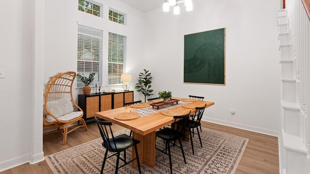 30 Stone Terrace Dr, Austin, TX 78734 - dining room featuring wood finished floors, baseboards, and a chandelier