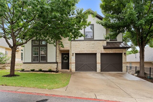 30 Stone Terrace Dr, Austin, TX 78734 - view of front of property featuring stone siding, a garage, driveway, a standing seam roof, and stucco siding