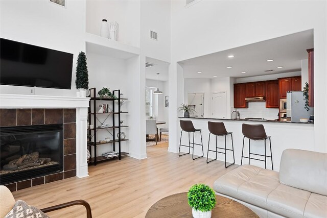 30 Stone Terrace Dr, Austin, TX 78734 - living area featuring light wood-type flooring, a fireplace, and recessed lighting