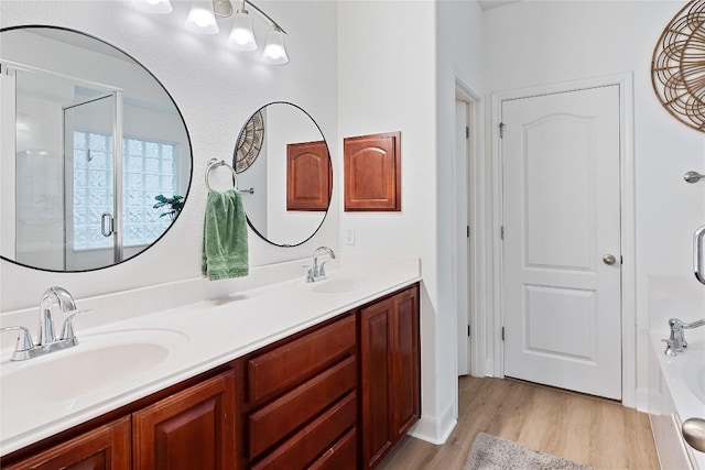 30 Stone Terrace Dr, Austin, TX 78734 - full bath with wood finished floors, double vanity, a tub to relax in, and an enclosed shower