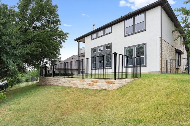 30 Stone Terrace Dr, Austin, TX 78734 - back of property with a fenced backyard, stucco siding, and stone siding