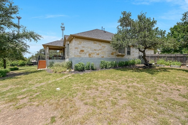 11009 Arbole Cv, Austin, TX 78739 - view of side of home with stone siding, stairway, and a shingled roof