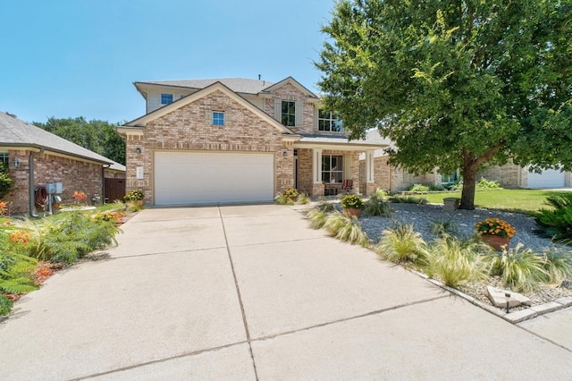 161 Serene Hollow Ln, Buda, TX 78610 - traditional home featuring brick siding, driveway, and an attached garage