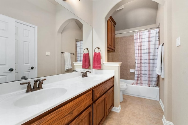 161 Serene Hollow Ln, Buda, TX 78610 - full bath with double vanity, toilet, tile patterned floors, shower / bath combo, and baseboards