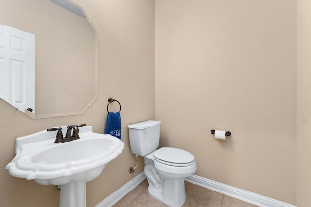 161 Serene Hollow Ln, Buda, TX 78610 - half bath featuring tile patterned flooring, toilet, and baseboards