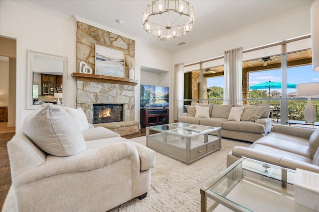 1016 Santaluz Path, Austin, TX 78732 - living room featuring a chandelier, ornamental molding, and a fireplace