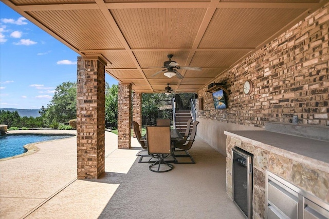 1016 Santaluz Path, Austin, TX 78732 - view of patio with outdoor dining space, a ceiling fan, an outdoor pool, and stairway