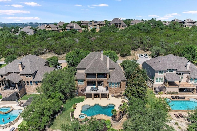 1016 Santaluz Path, Austin, TX 78732 - aerial perspective of suburban area featuring a pool