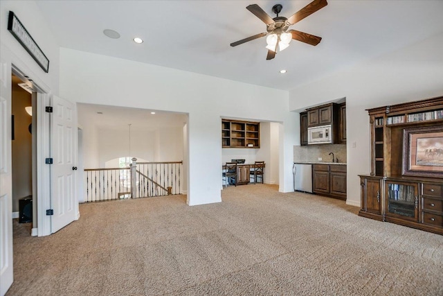 1016 Santaluz Path, Austin, TX 78732 - living room with light colored carpet, ceiling fan, and recessed lighting