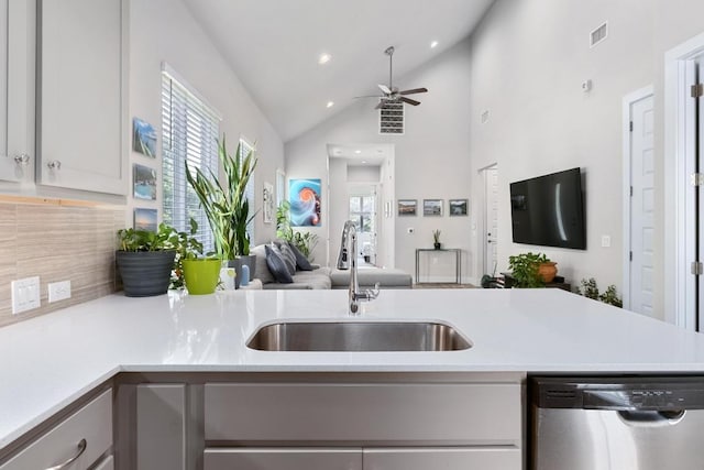 213 Virtus Bnd Unit 25, Austin, TX 78748 - kitchen with dishwasher, a sink, open floor plan, light countertops, and lofted ceiling