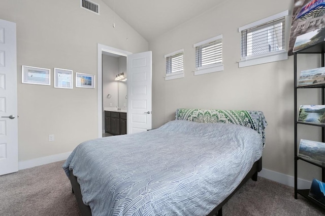 213 Virtus Bnd Unit 25, Austin, TX 78748 - bedroom with carpet floors, lofted ceiling, baseboards, and ensuite bathroom