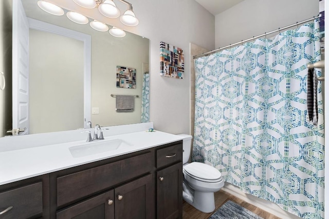 213 Virtus Bnd Unit 25, Austin, TX 78748 - full bath with vanity, toilet, wood finished floors, and curtained shower