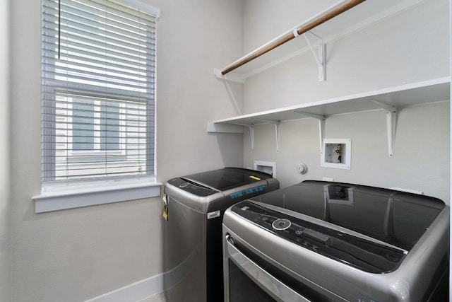 213 Virtus Bnd Unit 25, Austin, TX 78748 - washroom with washing machine and clothes dryer and baseboards