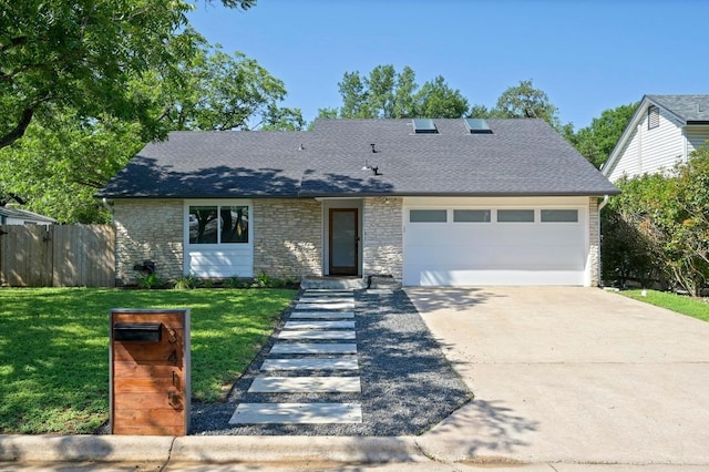 3415 Clarksburg Dr, Austin, TX 78745 - view of front of property with an attached garage, concrete driveway, a shingled roof, and stone siding