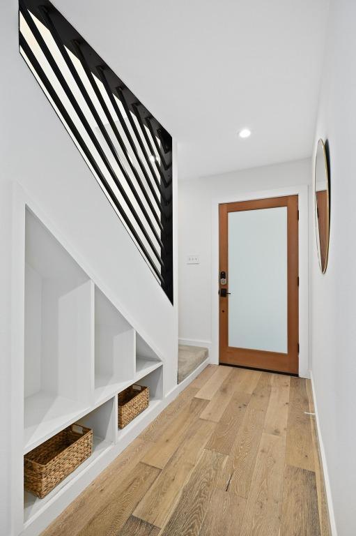 3415 Clarksburg Dr, Austin, TX 78745 - doorway with light wood finished floors, recessed lighting, baseboards, and built in features