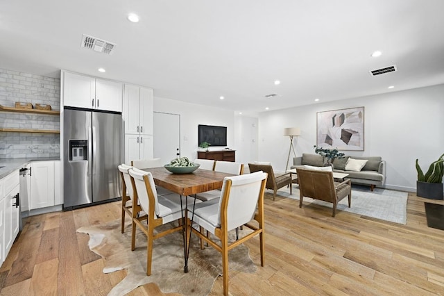 3415 Clarksburg Dr, Austin, TX 78745 - dining room featuring light wood-type flooring and recessed lighting