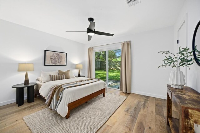 3415 Clarksburg Dr, Austin, TX 78745 - bedroom with access to exterior, wood finished floors, and baseboards