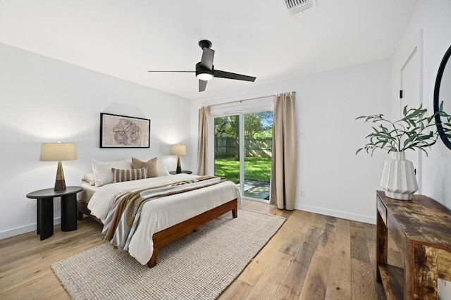 3415 Clarksburg Dr, Austin, TX 78745 - bedroom featuring access to exterior, wood finished floors, and ceiling fan