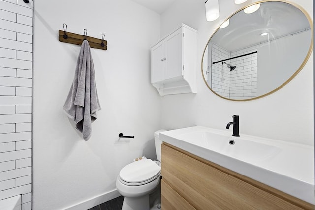 3415 Clarksburg Dr, Austin, TX 78745 - bathroom with vanity, a shower, toilet, and baseboards