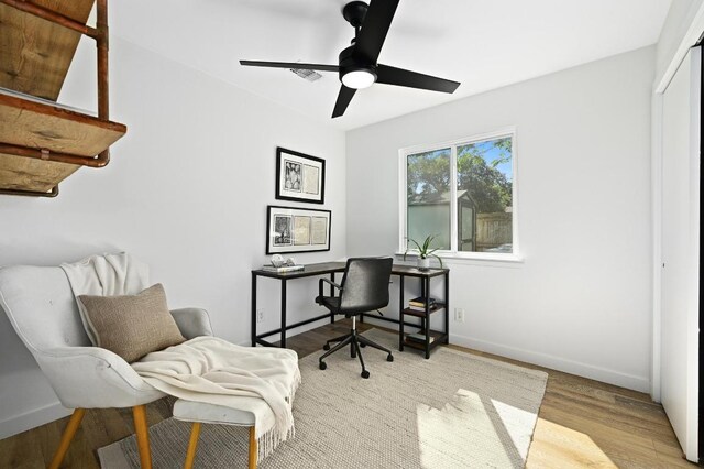 3415 Clarksburg Dr, Austin, TX 78745 - home office with wood finished floors, a ceiling fan, and baseboards