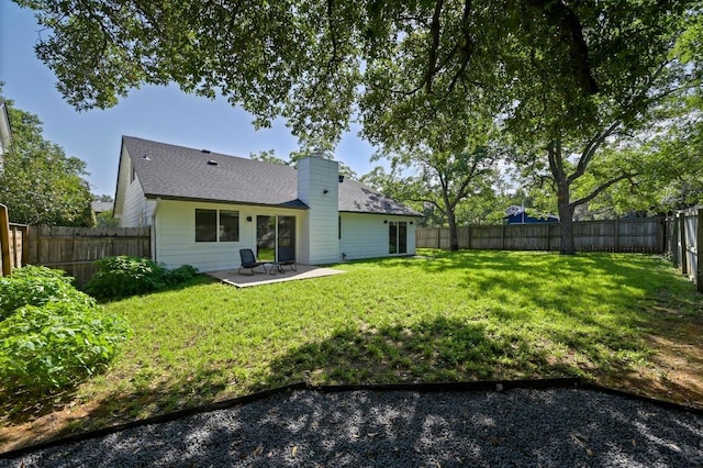 3415 Clarksburg Dr, Austin, TX 78745 - rear view of house with a patio, a chimney, and a shingled roof