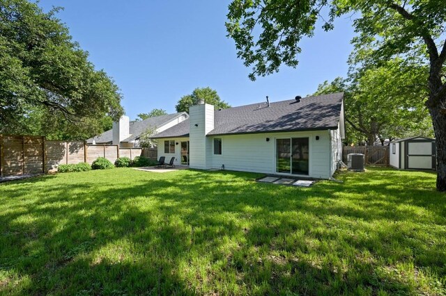 3415 Clarksburg Dr, Austin, TX 78745 - back of property with central air condition unit, a chimney, and a shingled roof