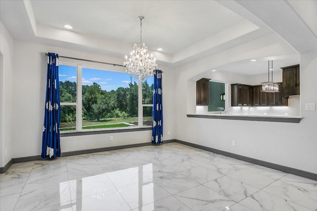 427 Bella Montagna Cir, Austin, TX 78734 - unfurnished dining area featuring a chandelier, a tray ceiling, baseboards, and recessed lighting
