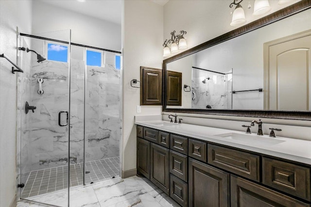 427 Bella Montagna Cir, Austin, TX 78734 - bathroom featuring marble look tile flooring, a marble finish shower, double vanity, and baseboards