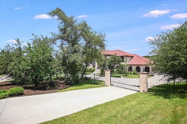 427 Bella Montagna Cir, Austin, TX 78734 - view of yard featuring concrete driveway and a gate