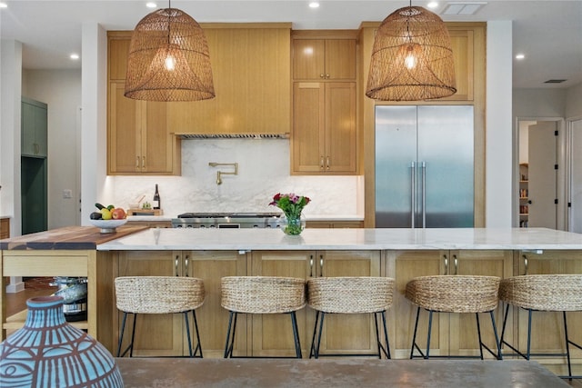 2024 Ford St, Austin, TX 78704 - kitchen with stainless steel built in refrigerator, concrete floors, decorative backsplash, light countertops, and recessed lighting