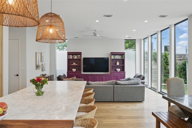 2024 Ford St, Austin, TX 78704 - living room with floor to ceiling windows, light wood finished floors, and recessed lighting