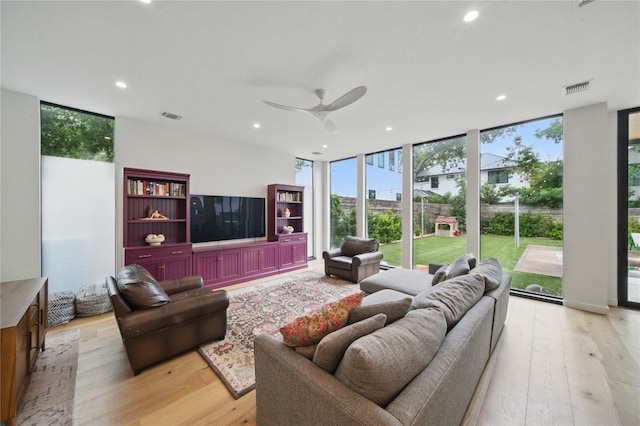 2024 Ford St, Austin, TX 78704 - living room with floor to ceiling windows, light wood finished floors, recessed lighting, and ceiling fan