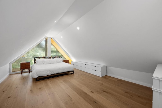 2024 Ford St, Austin, TX 78704 - bedroom with lofted ceiling, hardwood / wood-style flooring, and baseboards