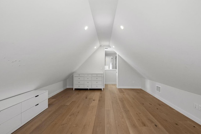 2024 Ford St, Austin, TX 78704 - additional living space featuring vaulted ceiling, baseboards, and light wood-style flooring