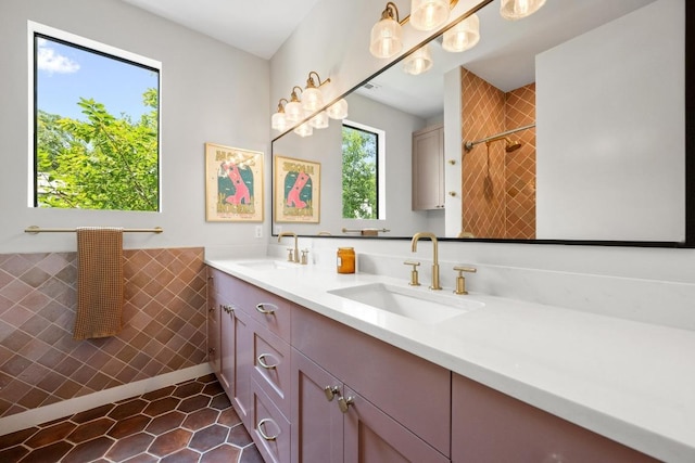 2024 Ford St, Austin, TX 78704 - full bathroom with tile walls, double vanity, tile patterned floors, a shower, and wainscoting