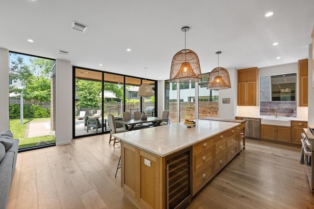 2024 Ford St, Austin, TX 78704 - kitchen with dishwasher, wine cooler, a sink, plenty of natural light, and a wall of windows