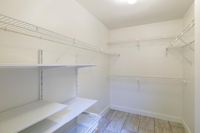 1307 Rambling Cv, Cedar Park, TX 78613 - spacious closet featuring wood tiled floors