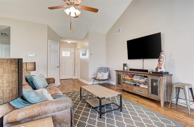 1307 Rambling Cv, Cedar Park, TX 78613 - living area with ceiling fan, wood finished floors, baseboards, and high vaulted ceiling