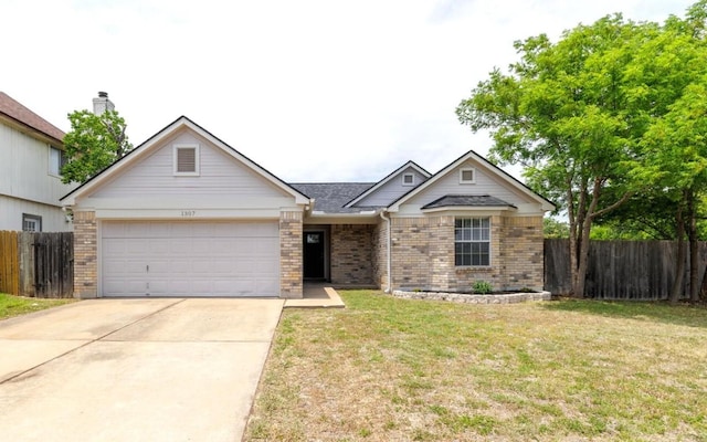 1307 Rambling Cv, Cedar Park, TX 78613 - view of front of property with a garage, driveway, and brick siding