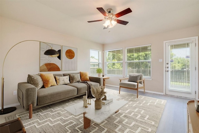 11117 Old Quarry Rd, Austin, TX 78717 - living room with baseboards, a ceiling fan, and light wood-style floors