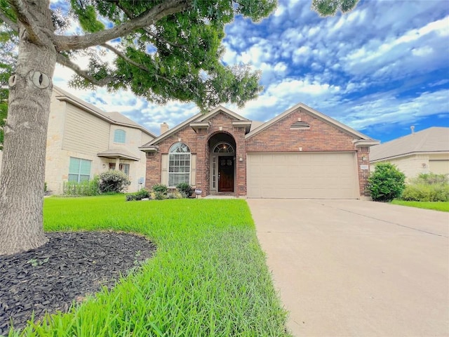 11117 Old Quarry Rd, Austin, TX 78717 - traditional-style home with brick siding, a garage, concrete driveway, and a front yard