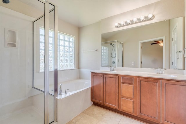 11117 Old Quarry Rd, Austin, TX 78717 - full bath with a stall shower, a bath, double vanity, tile patterned flooring, and ceiling fan