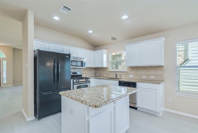 11117 Old Quarry Rd, Austin, TX 78717 - kitchen featuring appliances with stainless steel finishes, a sink, tasteful backsplash, white cabinetry, and recessed lighting