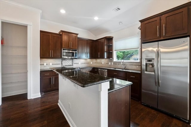 14501 Falcon Head Blvd Unit 43, Austin, TX 78738 - kitchen with stainless steel appliances, open shelves, dark stone counters, a kitchen island, and crown molding