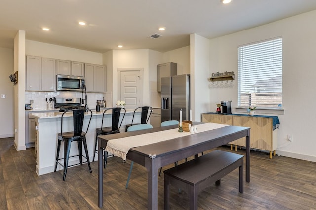 98 Barton Creek Ln, Hutto, TX 78634 - dining space with dark wood-style floors, recessed lighting, and baseboards