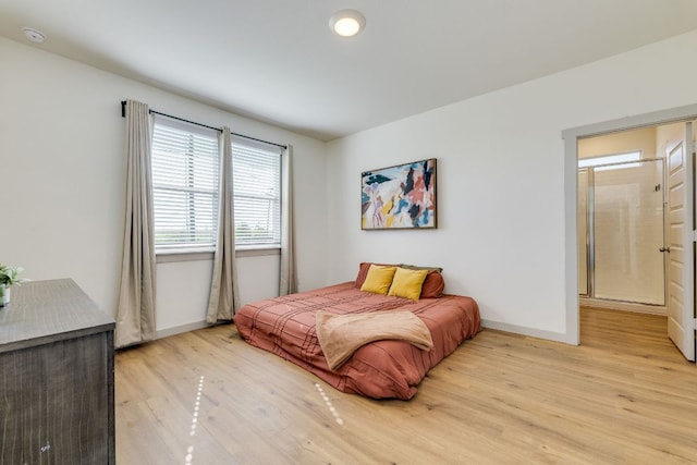 98 Barton Creek Ln, Hutto, TX 78634 - bedroom featuring baseboards and light wood finished floors