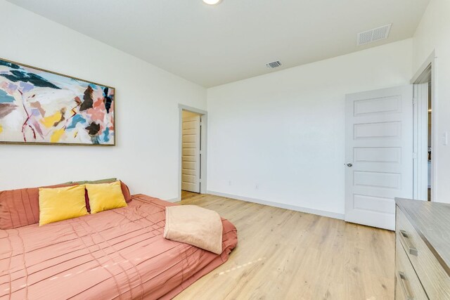 98 Barton Creek Ln, Hutto, TX 78634 - bedroom featuring light wood-style flooring and baseboards